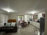 Man and Dog Log Cabin Tourism Africa